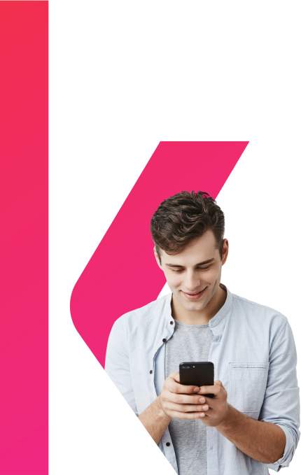 handsome-joyful-student-with-dark-hair-wearing-blue-shirt-messaging-typing-message-using-free-onlipe-app-on-his-smartphone-looking-at-screen-with-smile-posing-1.png